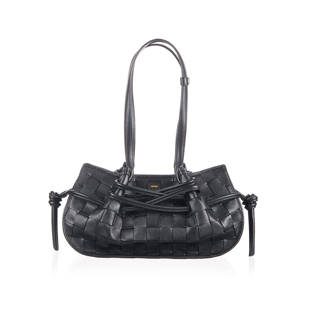 Black woven handbag with decorative straps.