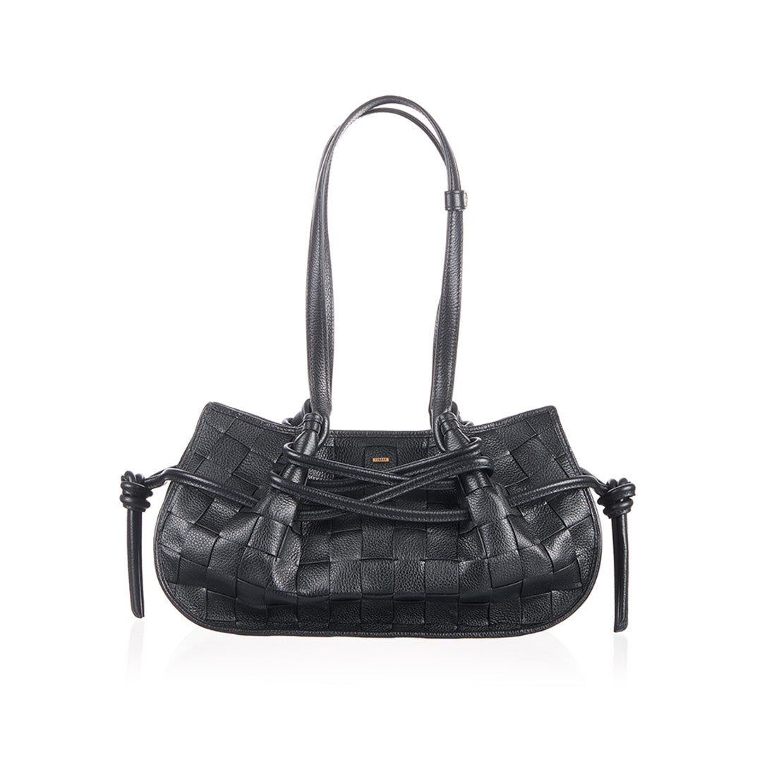 Black woven handbag with decorative straps.